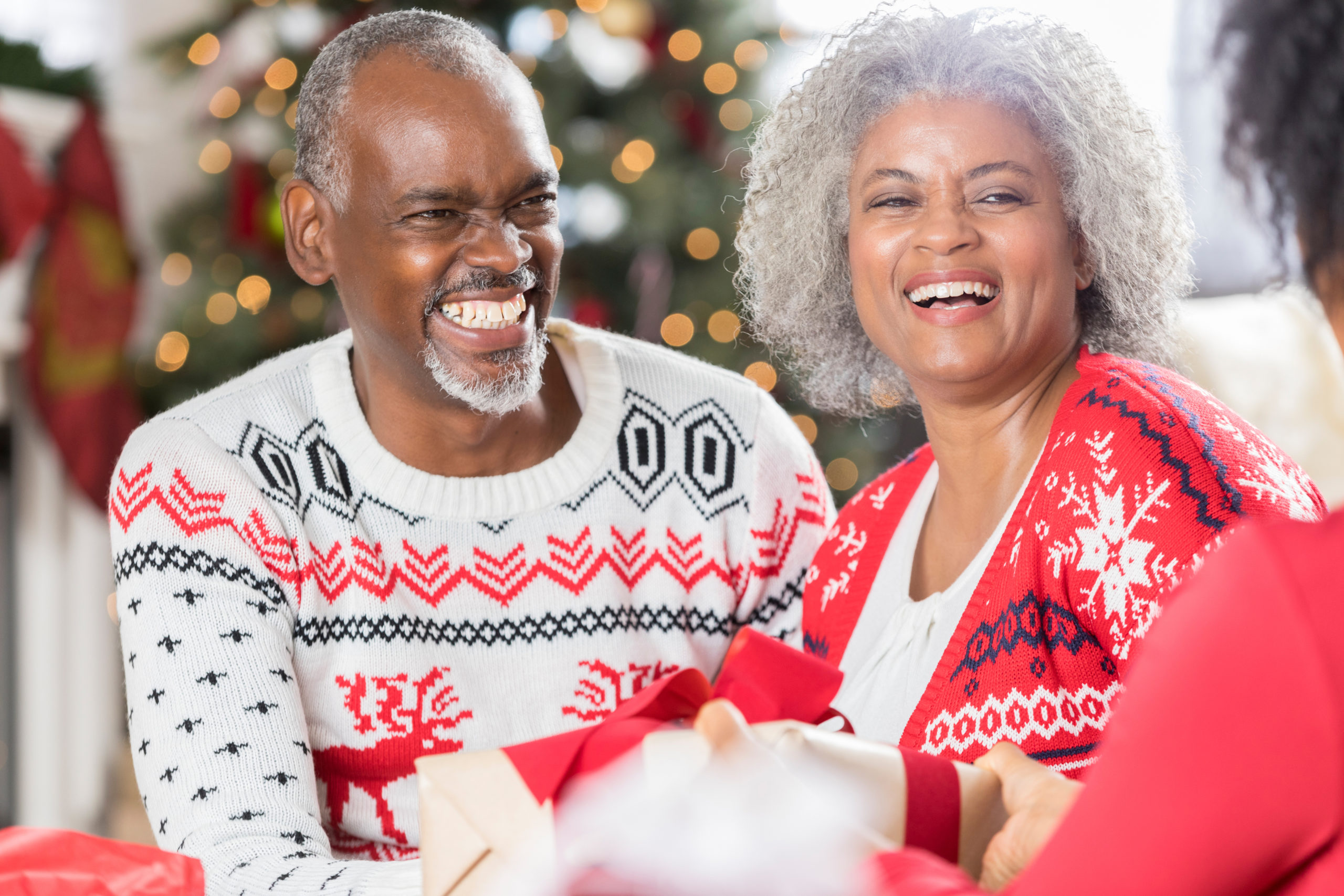 Happy senior couple spend Christmas with family